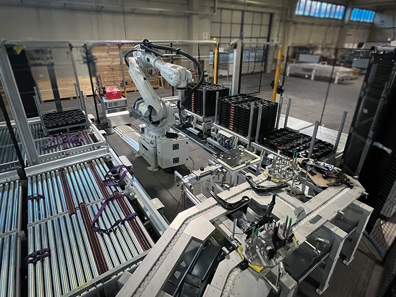 EWAB robot cell with different conveyor types